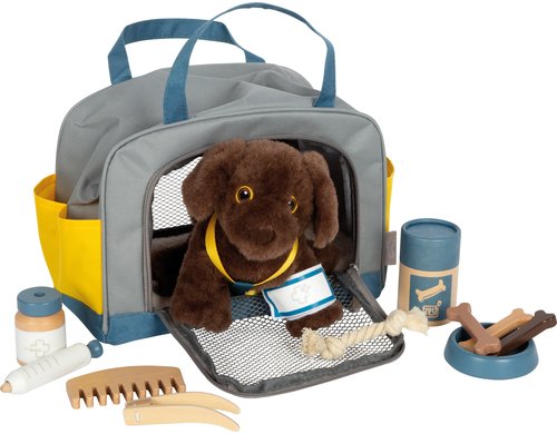 Hund mit Tasche und Pflege-Set